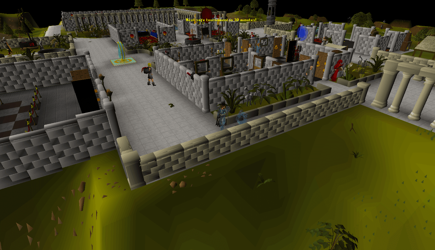 The home plaza from a high camera, with the fountain and the paved walkway through the centre and the arena stands in the distance